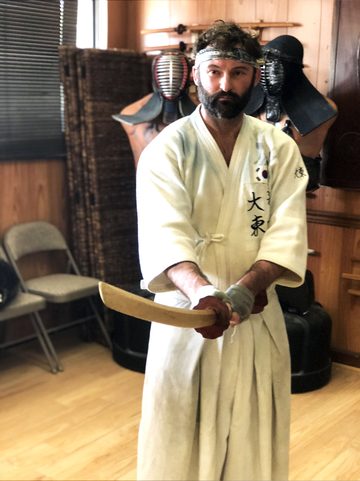 Head coach of Excalibur Academy in the training hall
